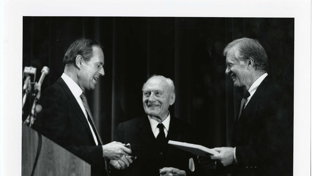One of Gum's most memorable stories was covering the address to freshmen by then-University President Steven Muller, pictured in 1987 with former U.S. President Jimmy Carter and Alfred Carl Toepfer.