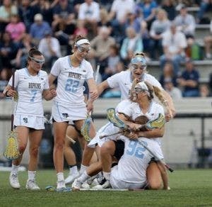  Courtesy of Haley Schweizer
Senior midfielder Haley Schweizer and her teammates celebrate.