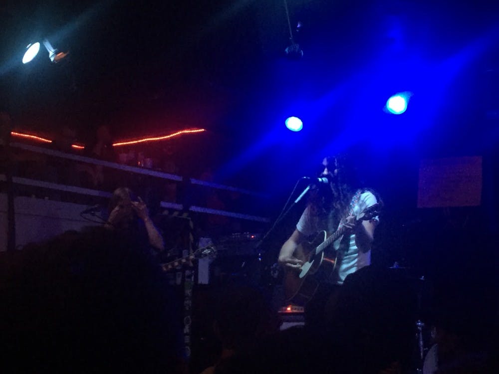 COURTESY OF KATHRYN BUCHSER
Kurt Vile (right) plays guitar in his recent Ottobar show, where he exhibited everything from classic ‘70s rock to skilled banjo.