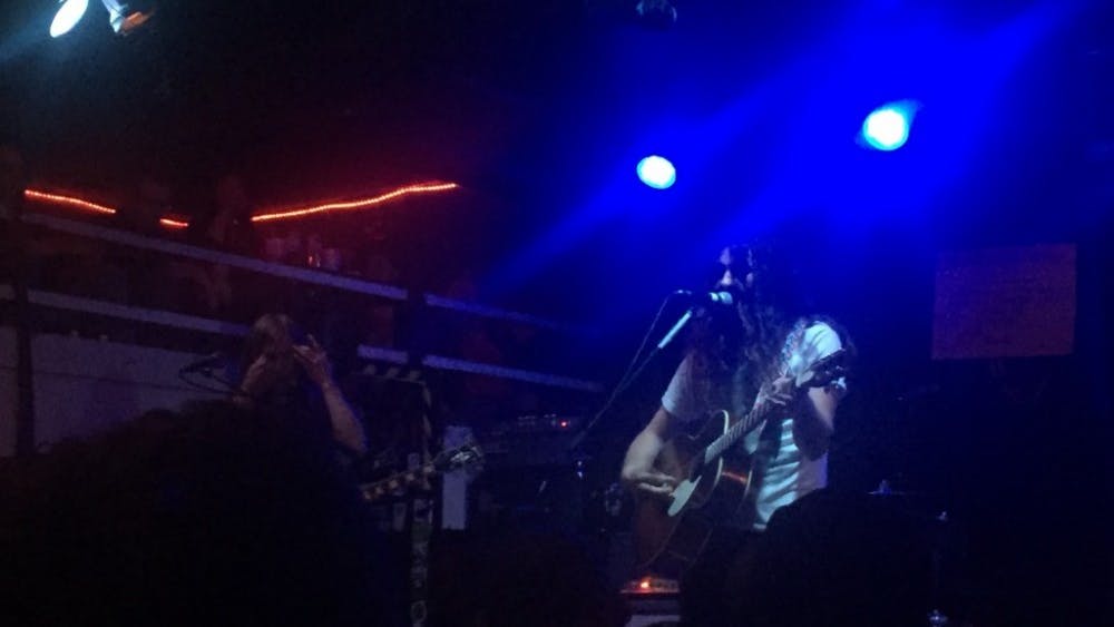  COURTESY OF KATHRYN BUCHSER
Kurt Vile (right) plays guitar in his recent Ottobar show, where he exhibited everything from classic ‘70s rock to skilled banjo.