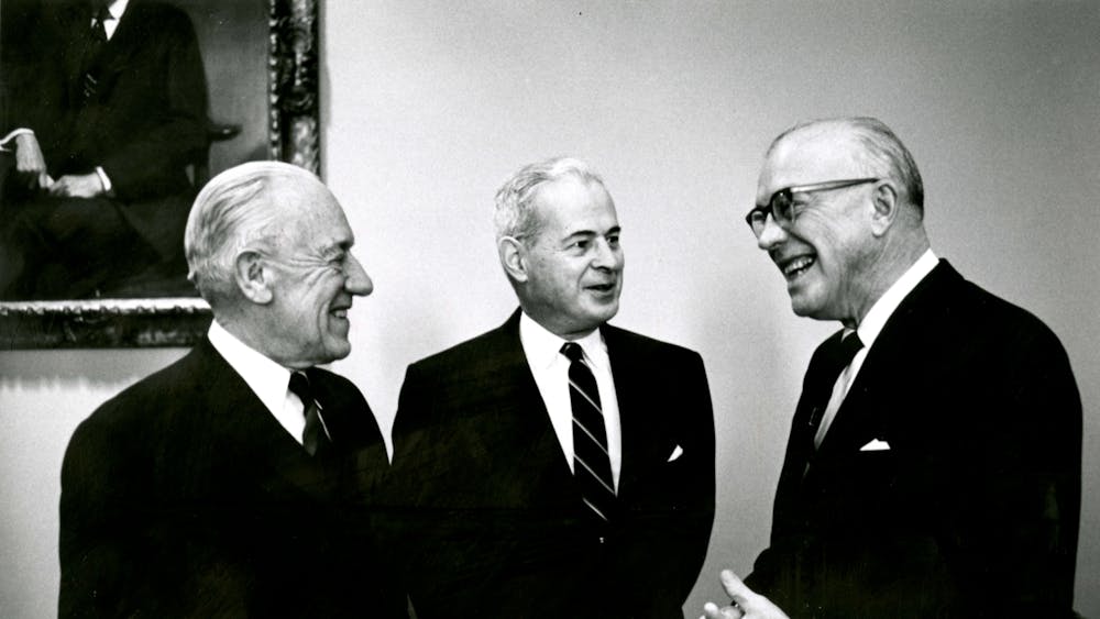 COURTESY OF THE UNIVERSITY ARCHIVES — SHERIDAN LIBRARIES 
Reutter was Editor-in-Chief when University President Lincoln Gordon, pictured with University Presidents Milton S. Eisenhower and Detlev Bronk, was removed by a no-confidence vote in 1971.
