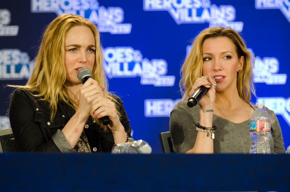 HEROES & VILLAINS/CC BY-SA 2.0
Caity Lotz (left) and Katie Cassidy starred on Arrow as sisters Sara and Laurel Lance, respectively.