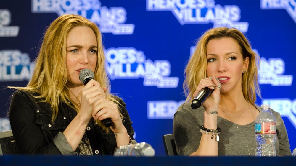 HEROES & VILLAINS/CC BY-SA 2.0
Caity Lotz (left) and Katie Cassidy starred on Arrow as sisters Sara and Laurel Lance, respectively.