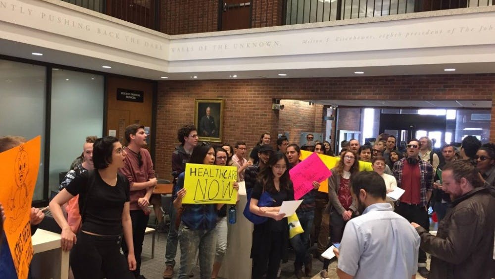 COURTESY OF SARAH Y. KIM
Graduate students gathered in Garland to demand more affordable and accessible University healthcare.