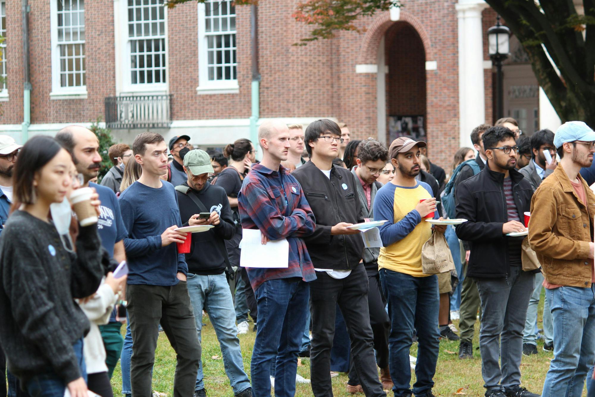 COURTESY OF ELVAR B. BJARKASON
PhD candidates Siddiqui and Brig-Ortiz encourage other Hopkins graduate students to vote in support of a union.