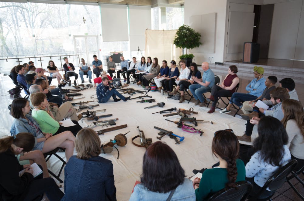  Courtesy of Kei Ito
Almost 40 people sat around the pop-up exhibit, which featured rifles created from household objects.