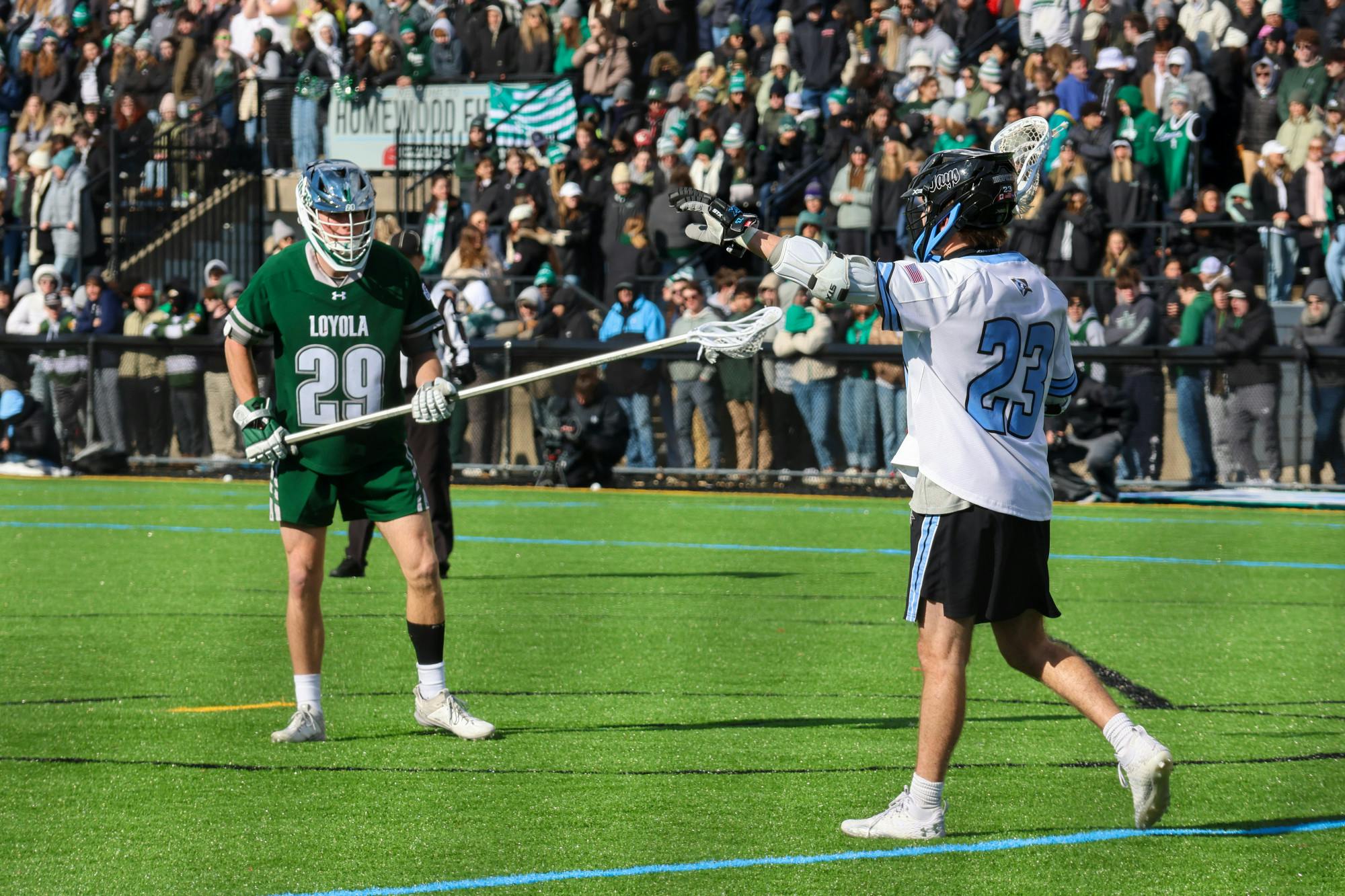 Homewood Field was filled with Blue Jay spirit as both men's and women’s lacrosse teams took the field against Loyola in the Battles of Charles Street.&nbsp;
