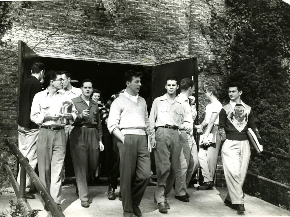 COURTESY OF THE JOHNS HOPKINS UNIVERSITY GRAPHIC AND PICTORIAL COLLECTION
Students exit a building after class circa the 1950s, around when Cleveland first arrived at Hopkins.