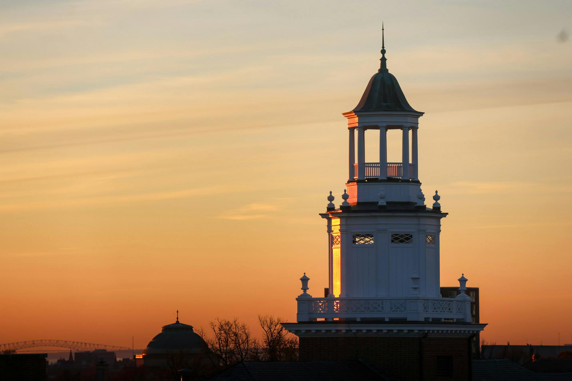Embark on a visual journey through Homewood Campus, as the sun paints hues and shadows across the landscape.