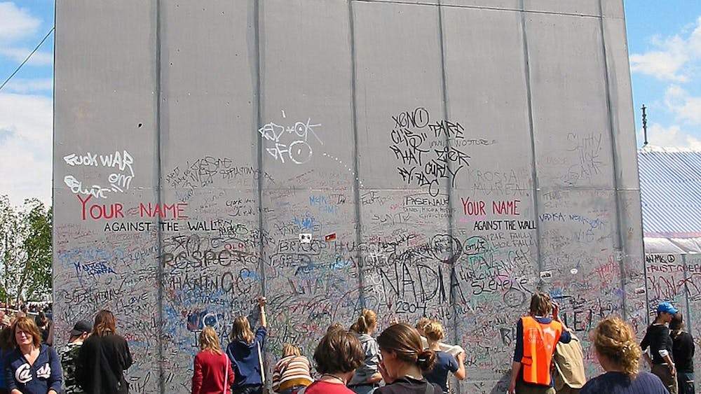 STIG NYGAARD / CC 2.0
In 2004, an art installment at the Roskilde Festival encouraged attendees to sign the wall to promote peace and protest a wall being built in Palestine.&nbsp;