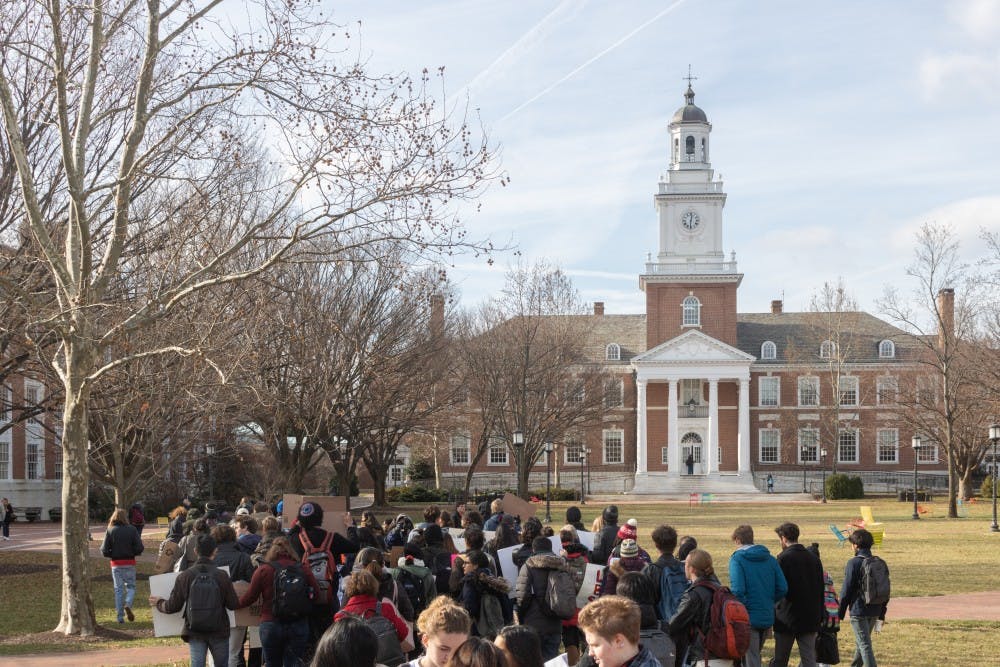 Protesters march from MSE library to Garland Hall.