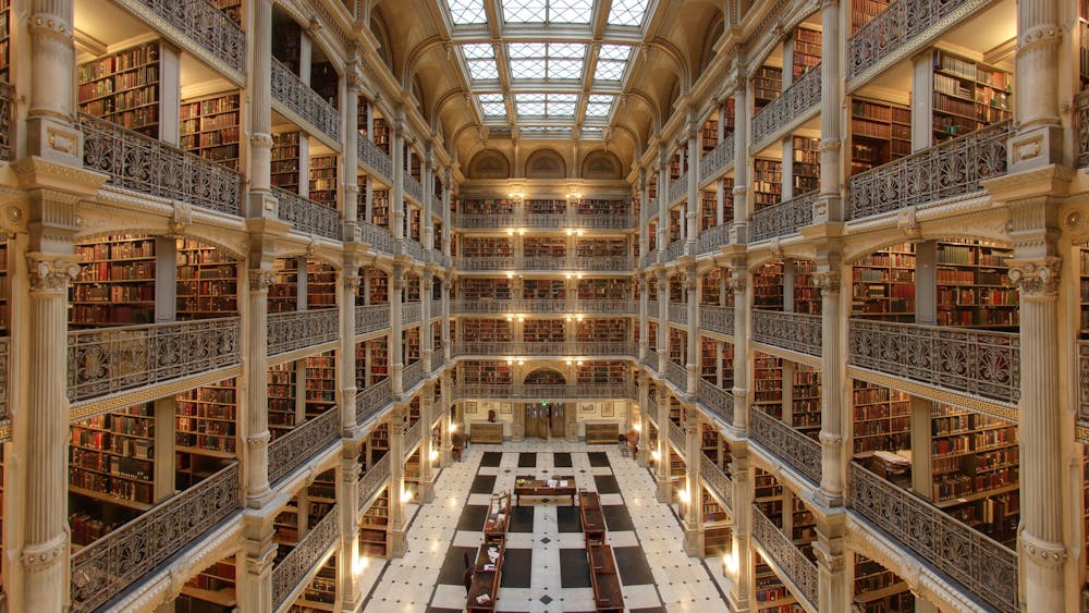COURTESY OF MATTHEW PETROFF
The George Peabody Library today houses special edition books, including a first edition of Charles Darwin’s On the Origin of Species.&nbsp;