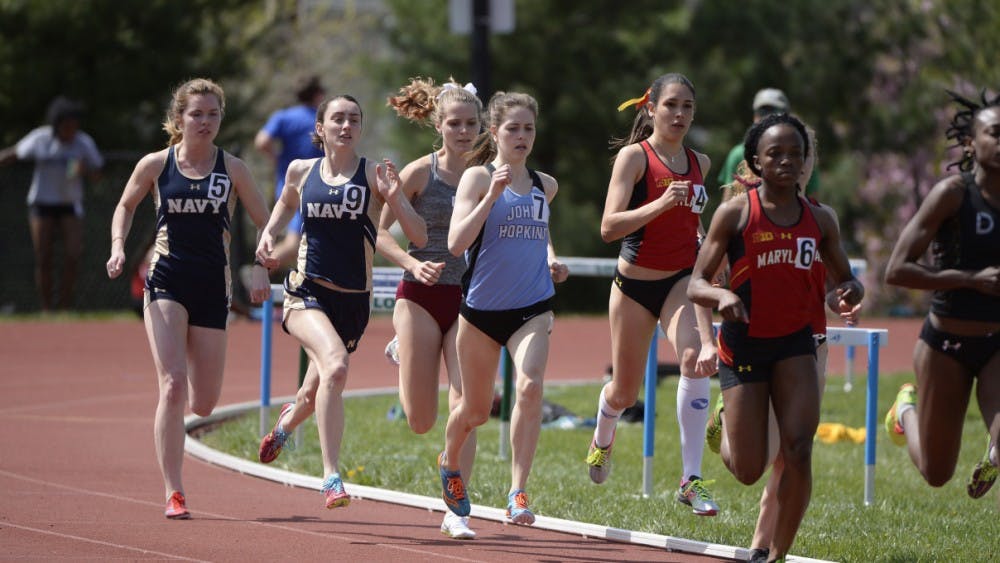 COURTESY OF HOPKINSSPORTS.COM

Senior Caroline Smith crosses the finish line in third place in the 1,500-meter run.