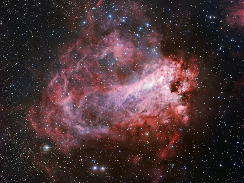 This image of the rose-coloured star forming region Messier 17 was captured by the Wide Field Imager on the MPG/ESO 2.2-metre telescope at ESO’s La Silla Observatory in Chile. It is one of the sharpest images showing the entire nebula and not only reveals its full size but also retains fine detail throughout the cosmic landscape of gas clouds, dust and newborn stars.