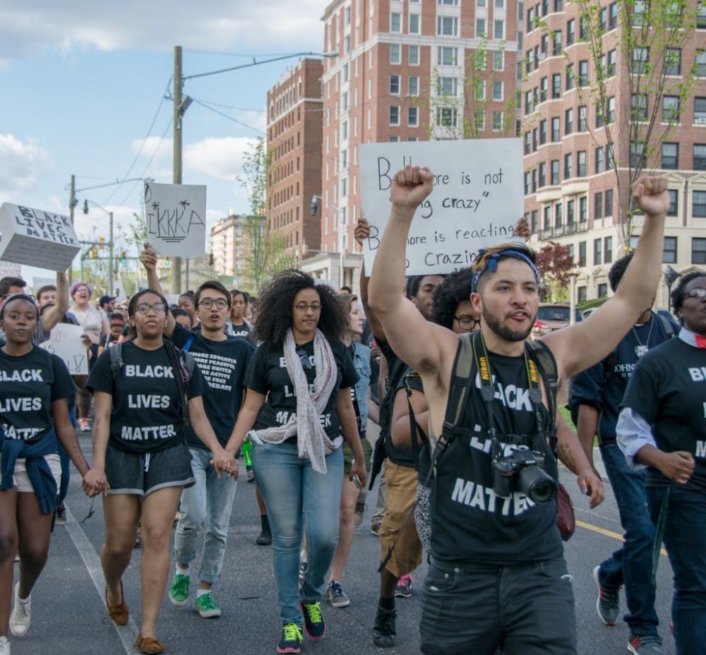  file photo
Hopkins students marched from campus to Penn Station and then City Hall during the uprising, joining with other local students.