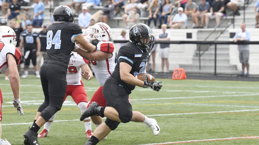 HOPKINSSPORTS.COM
Junior running back Luke Yakely scored a touchdown in the Blue Jays’ explosive second half.