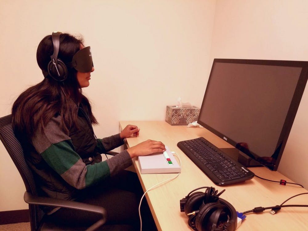  Kareem Osman/PHOTOGRAPHY EDITOR
A student completes a cognitive test while blindfolded as part of a study in the Bedny Lab in Ames 225.