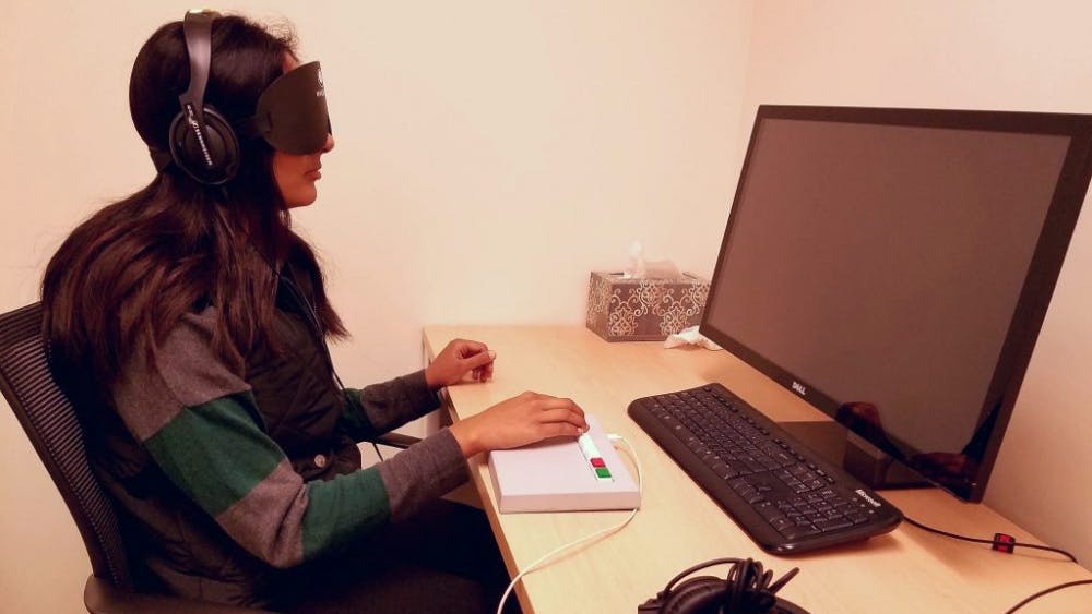  Kareem Osman/PHOTOGRAPHY EDITOR
A student completes a cognitive test while blindfolded as part of a study in the Bedny Lab in Ames 225.