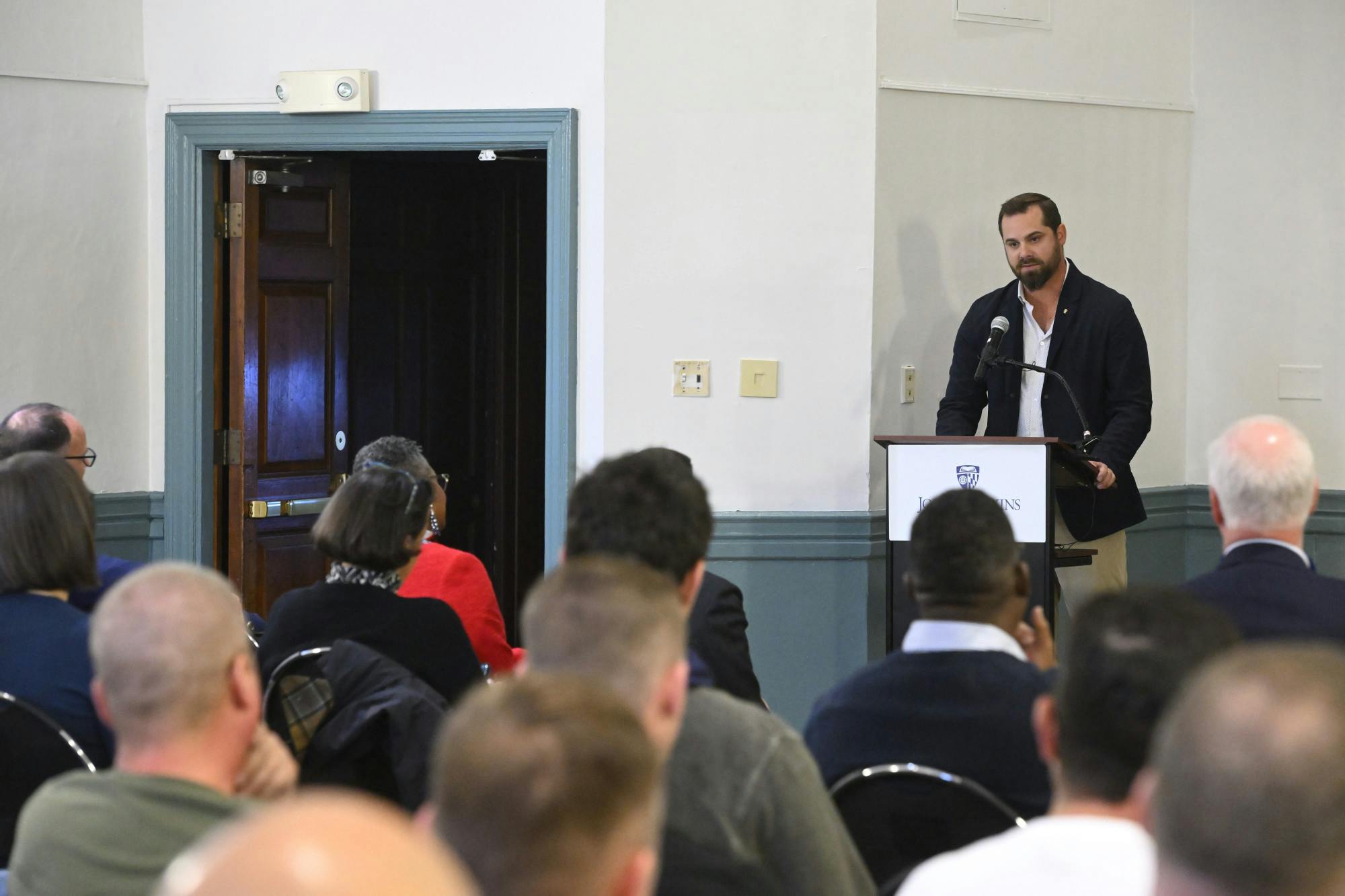 COURTESY OF WILL KIRK
2012 Hopkins graduate and former lacrosse player Andrew Coté honored veterans in the Hopkins community at a a Veterans Day ceremony.