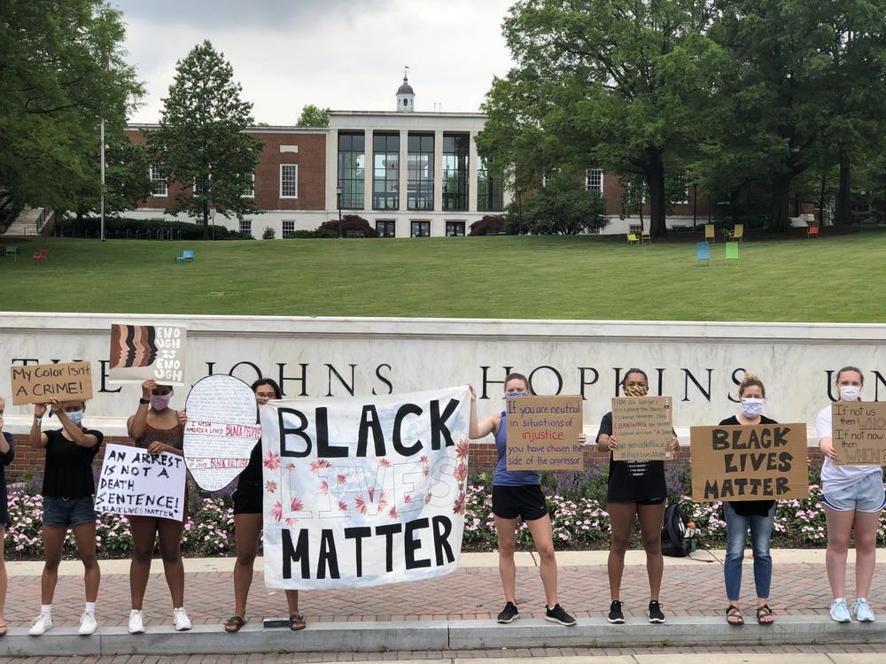 FILE PHOTO
Protesters gathered in front of the Hopkins sign in June to demand racial equality.