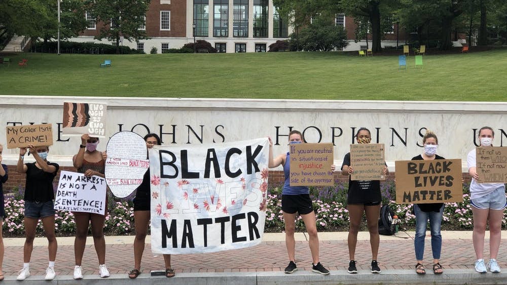 FILE PHOTO
Protesters gathered in front of the Hopkins sign in June to demand racial equality.