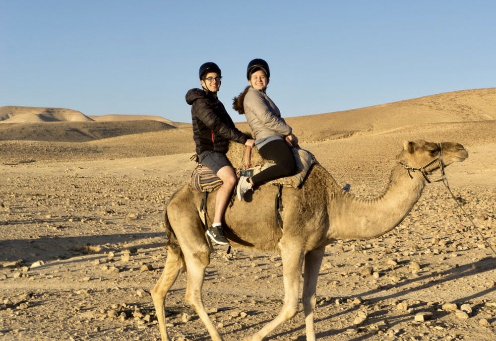Courtesy of Rudy Malcom
Malcom and sophomore Sabrina Sussman on a camel near the Kfar Hanokdim oasis.