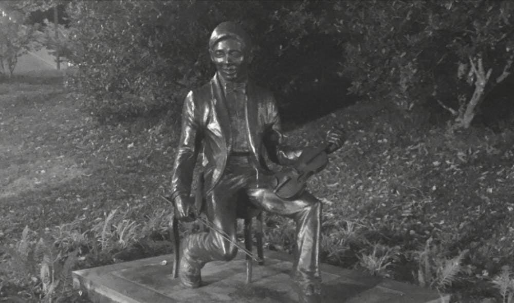  CINDY JIANG/PHOTOGRAPHY EDITOR
A statue commemorating Rex T. Chao stands on N. Charles Street, depicting Chao with his violin.