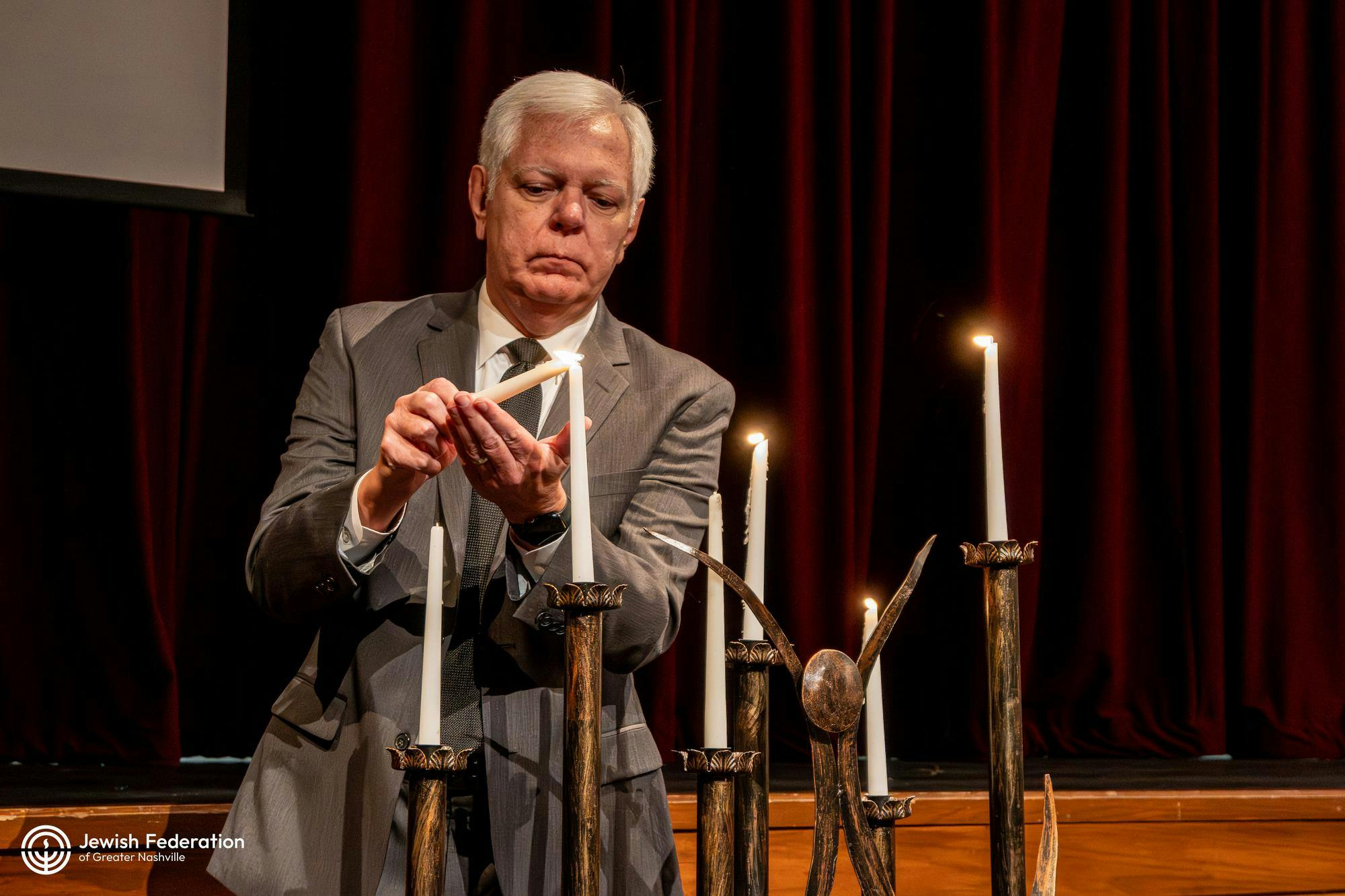 Phil Williams lighting candle.jpg