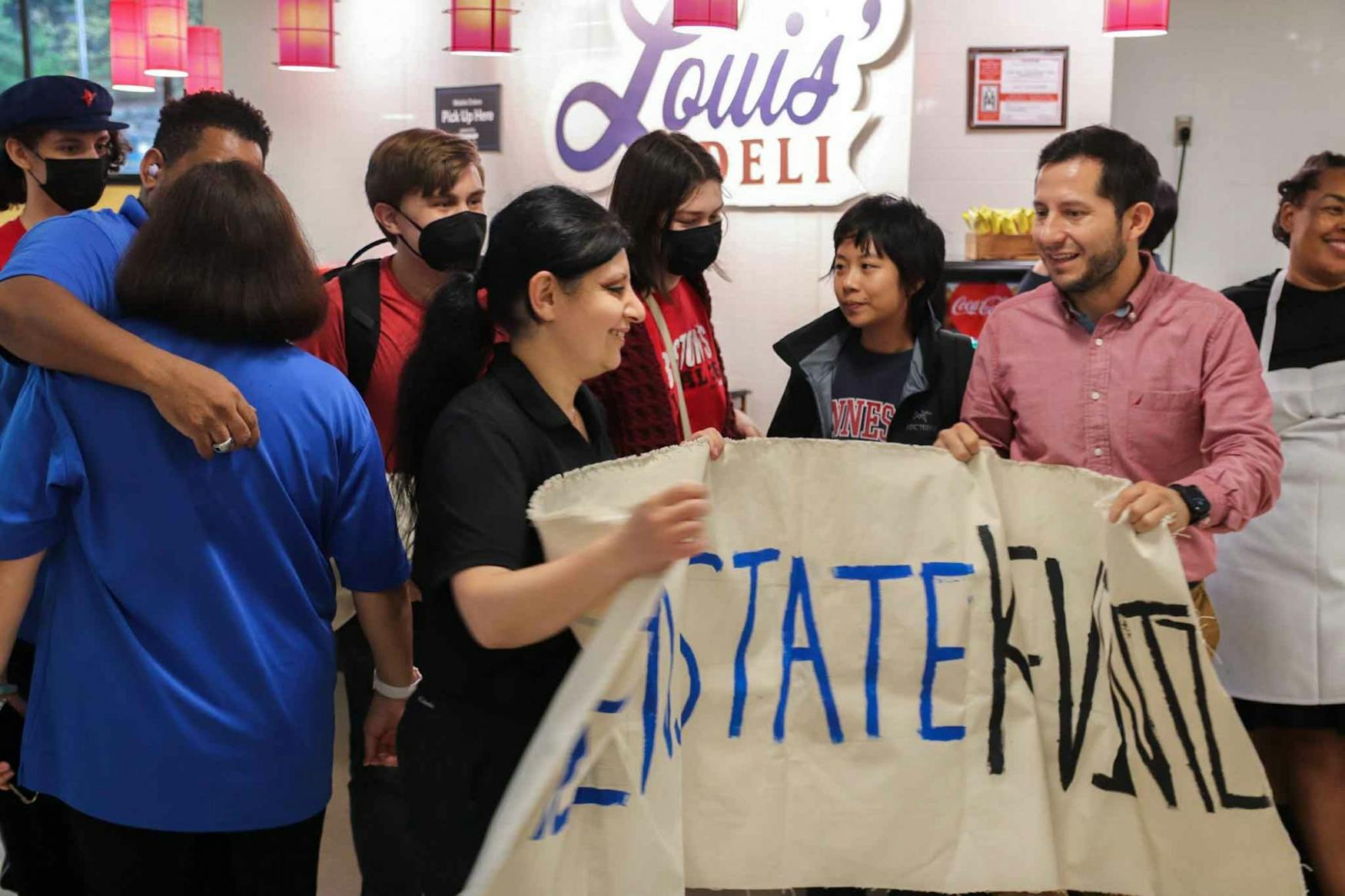 WORKER VOICES: The Brandeis Leftist Union gathered students and workers to protest for Merisier's reinstatement.
