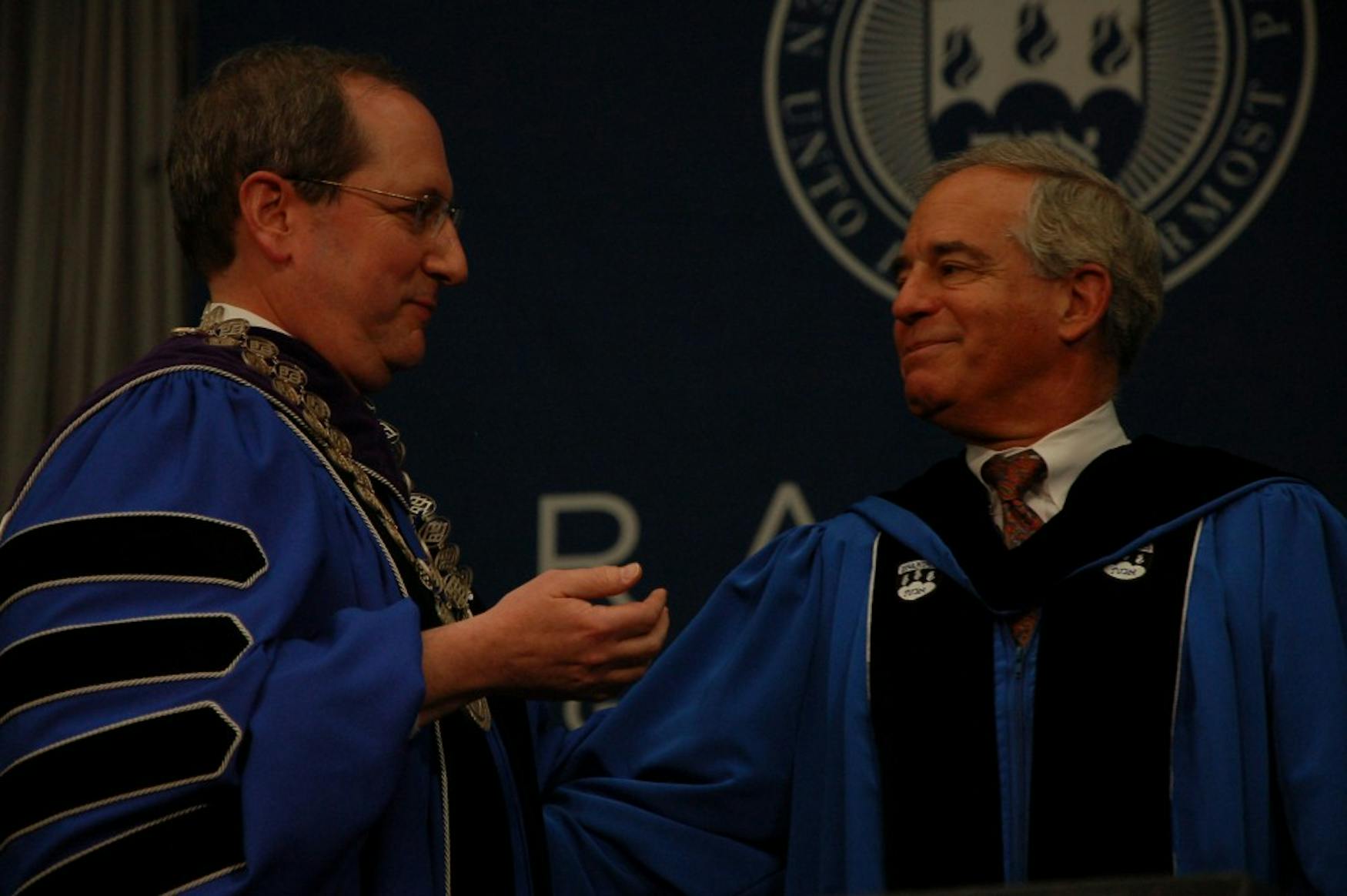 INITIATION: Former University President Jehuda Reinharz (right) welcomes the University's eighth President Frederick Lawrence.