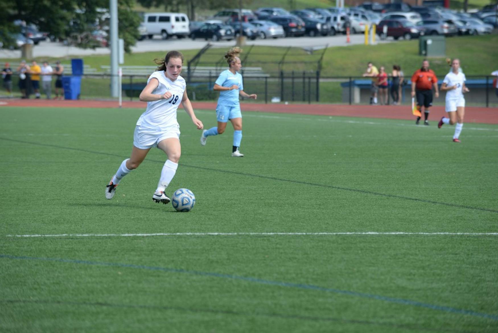 OPEN FIELD: Forward Samantha Schwartz ’18 controls the ball in a victory against Lasell College on Sept. 6 of last year.
