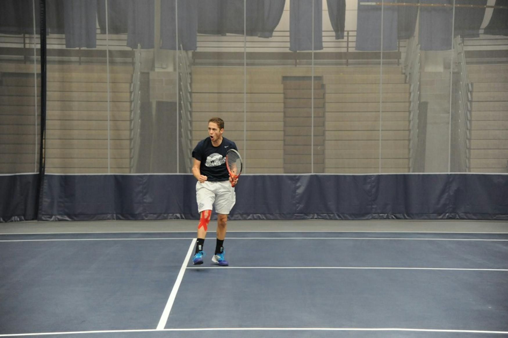 TOP SPIN: Danny Lubarsky ’16 wins a point during his match against the Coast Guard Bears this past Saturday at home.