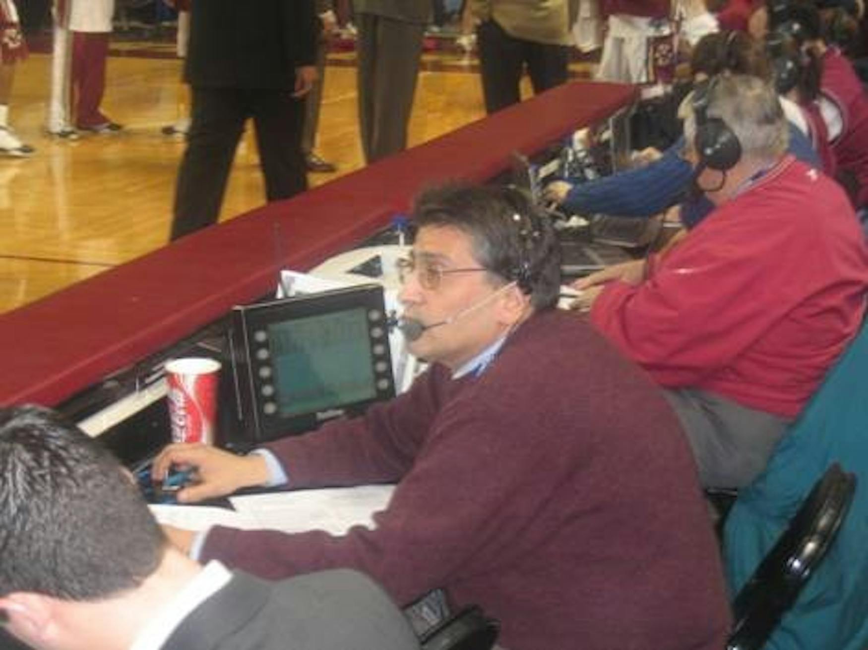 COURTSIDE SEATING: Jick sits among the scoring crew to call a Boston College Eagles game.