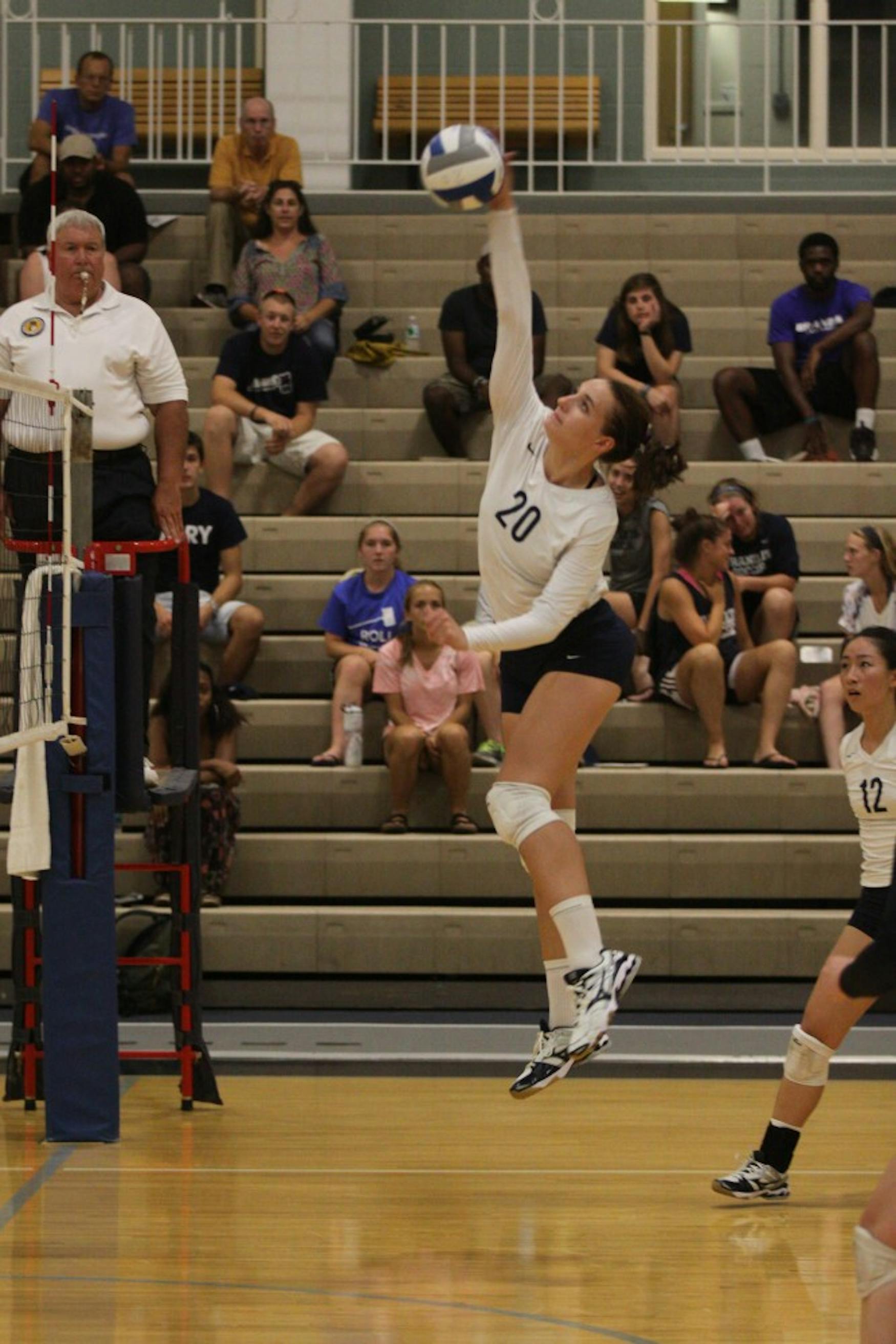 CLIMBING THE LADDER: Middle blocker Maddie Engeler ’16 attemps a spike during the Judges three-set defeat to the United States Coast Guard Academy last Friday. night.