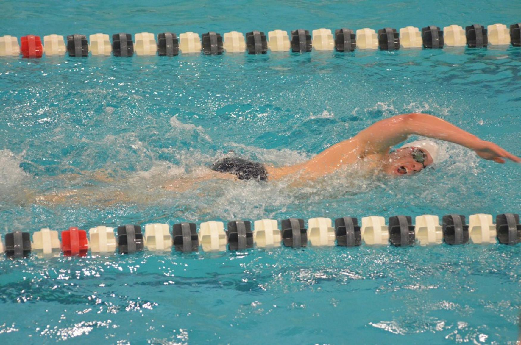 BACK IN THE POOL: Freestyle swimmer Joey Barr ’18 competes in the home meet against Bentley University on Nov. 21.
