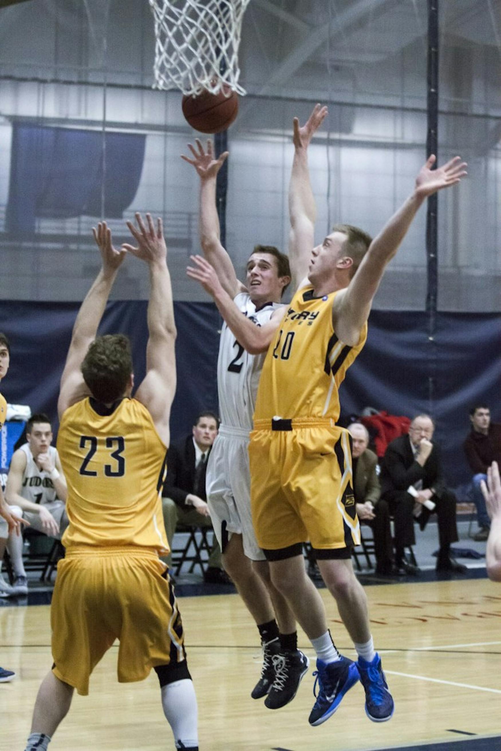 CONTESTED LOOK: Guard Colby Smith ’16 goes up for a shot in the Judges’ loss against Emory University on Jan. 30.