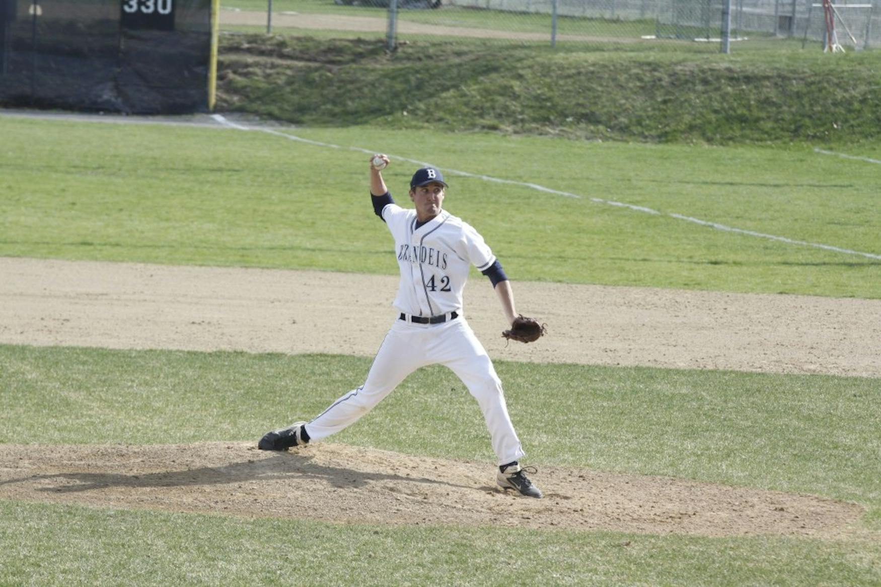 THE STRETCH: Pitcher Ryan Healy ’16 throws a pitch in the Judges’ 6-5 victory in 11 innings over Curry College last April 22.