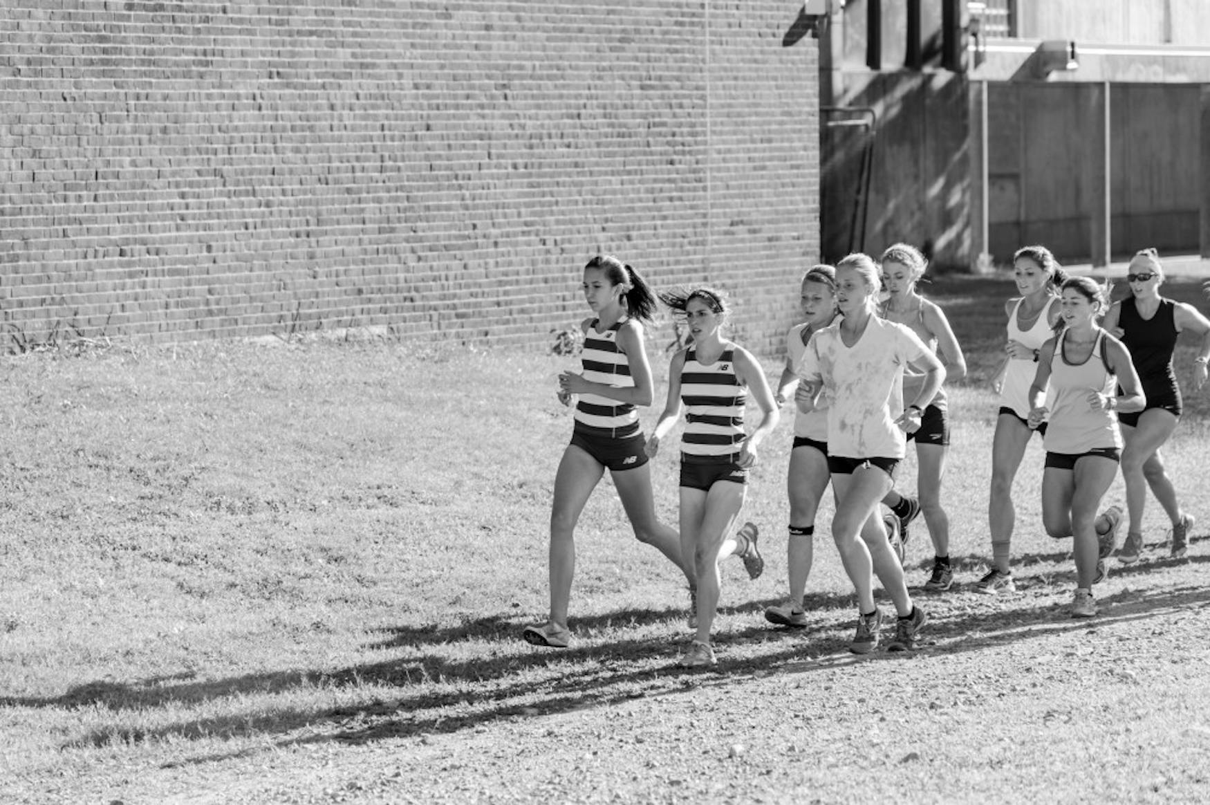 OUT IN FRONT: Maddie Dolins ’17 (front) and Kelsey Whitaker ’16 (left) lead a pack of runners in a home meet versus the University of Southern Maine, a meet won by the Judges.