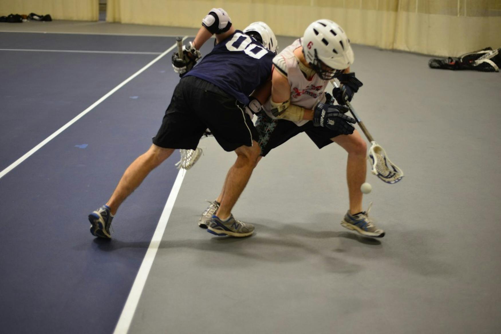 Eric Haavind-Berman ’15 (right) and James Hayward ’16 competing at  Saturday’s lacrosse practice