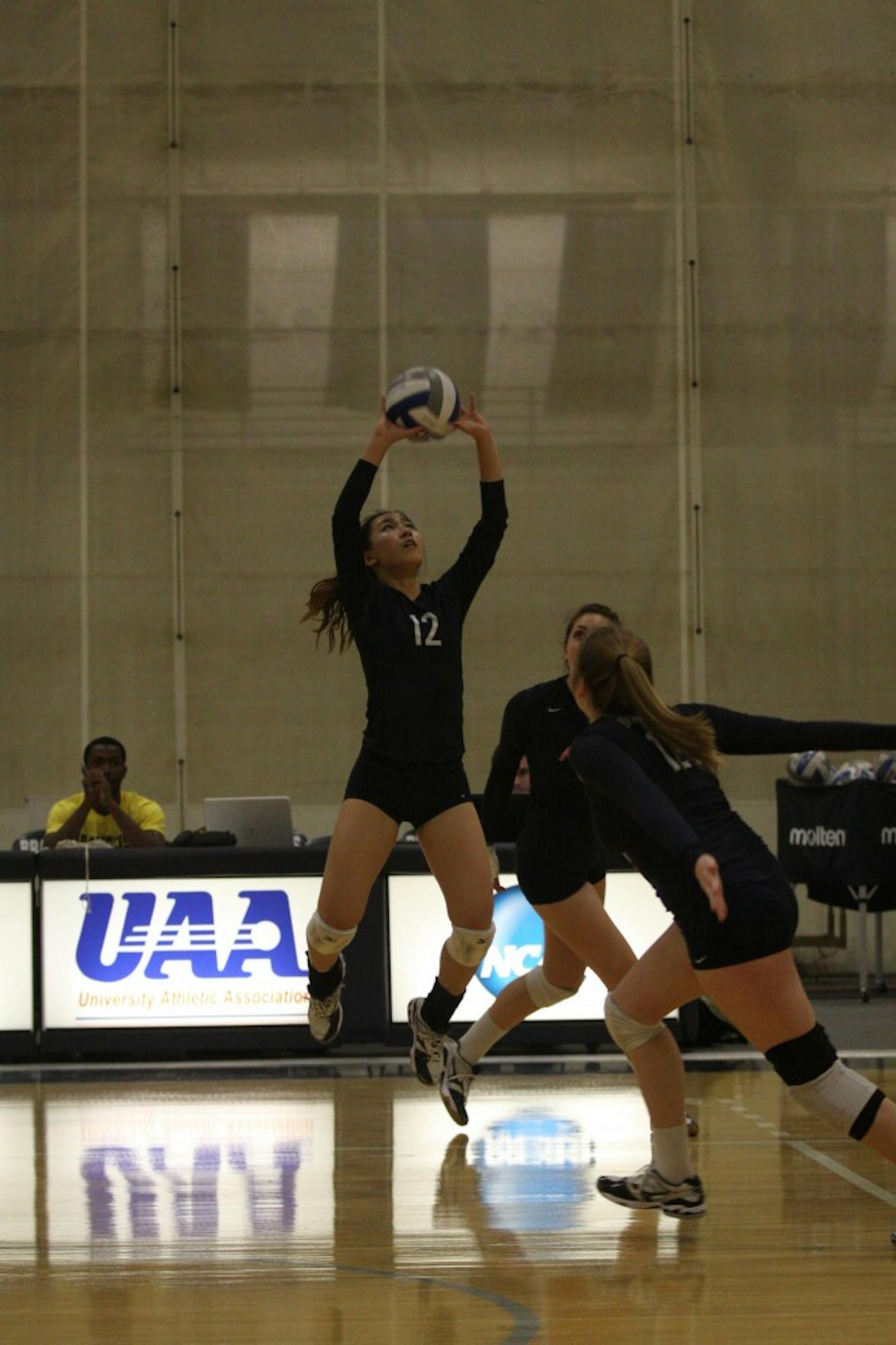 OFFENSIVE ATTACK: Setter Julie Kim ’18 (left) prepares a pass during the Judges’ sweep of Lasell College last Tuesday.
