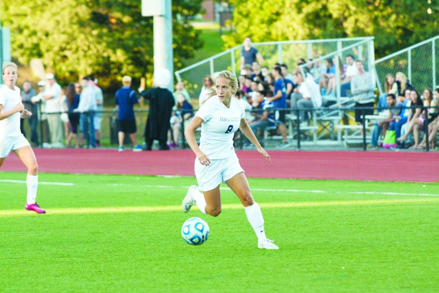 LOOKING TO PASS: Forward Haliana Burhans ’18 dribbles the ball down the left flank during Friday’s season-opening loss to MIT.