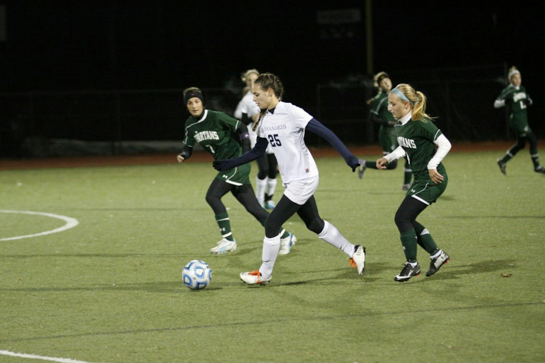 Forward Melissa Darling ’16 (center) dribbles between two Castleton State defenders during the Judges’ loss in the ECAC Tournament last November.