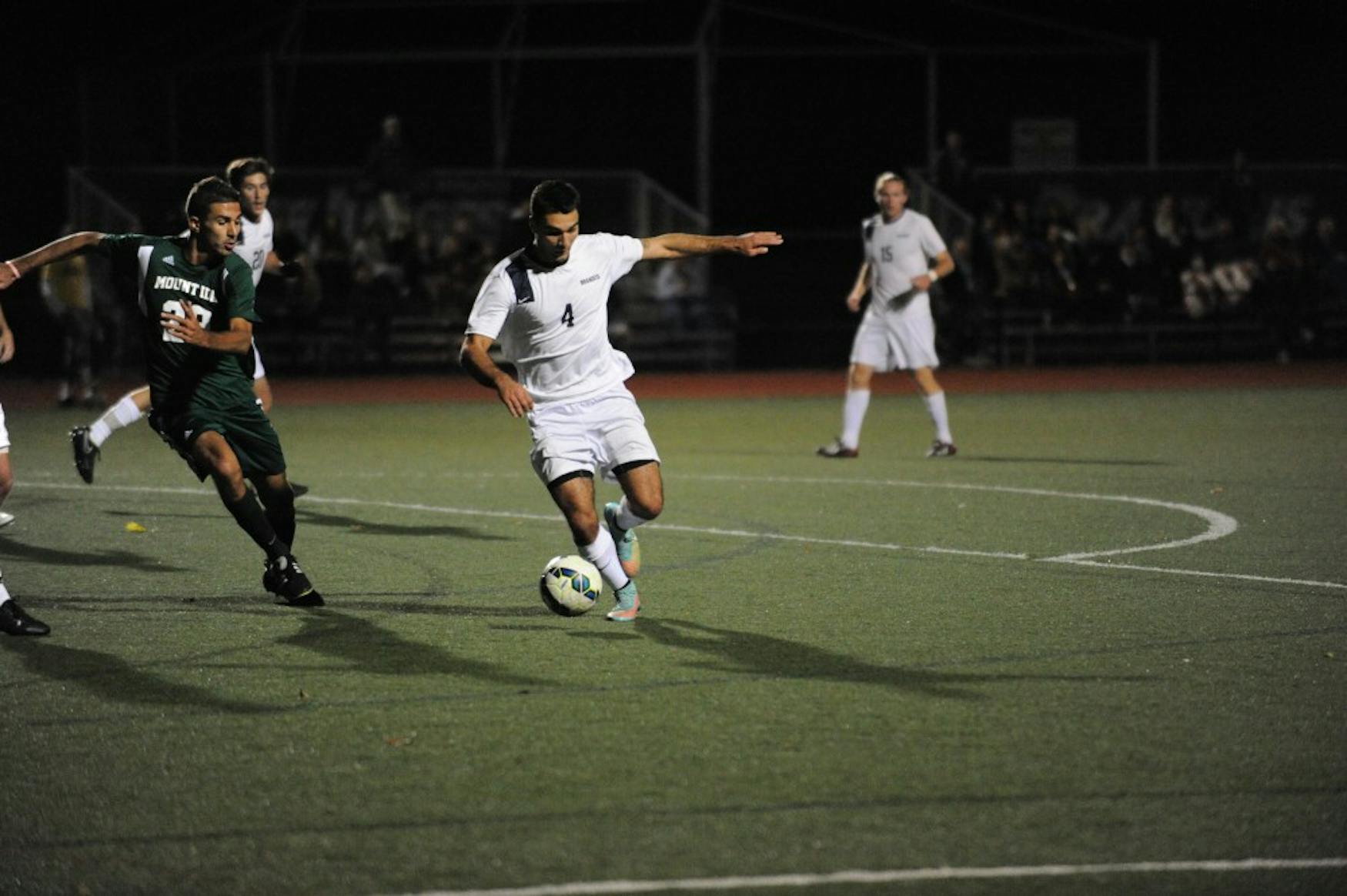 PREPARING A SHOT: Forward Zach Vieira ’17 dribbles through the 18-yard box in a 5-0 win over Mount Ida College on Oct. 27.