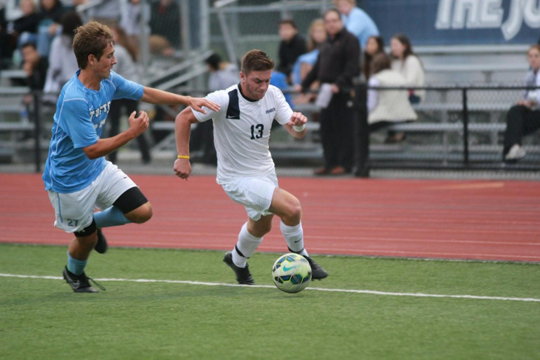 ONE-ON-ONE: Forward Mike Lynch ’17 outruns at Tufts defender during the Judges’ 2-0 victory Saturday on Gordon Field.