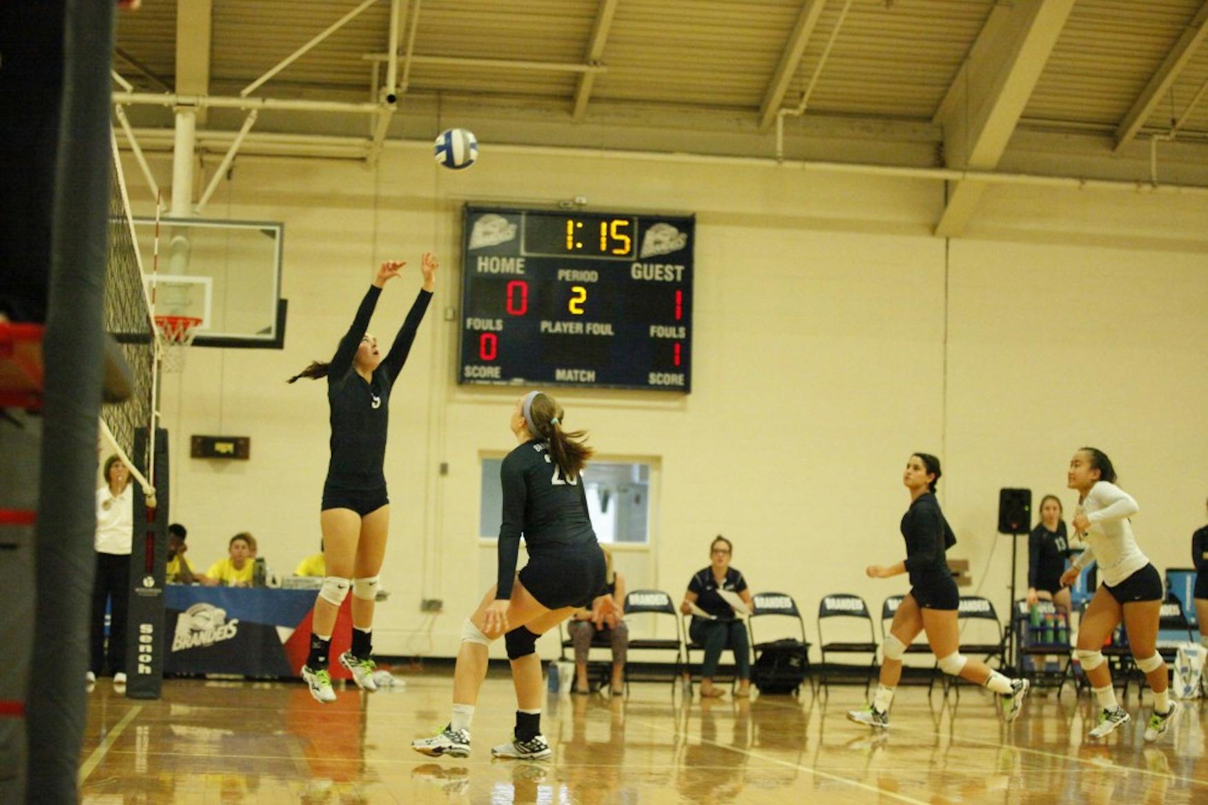 SETTING UP: Setter Allison Harmsworth ’19 passes the ball to middle hitter Maddie Engeler ’16 in the contest on Saturday.