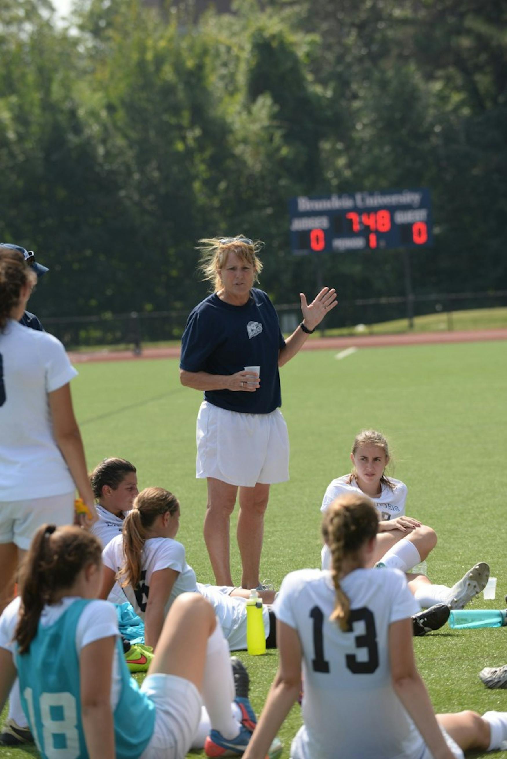 PEP TALK: Coach Denise Dallamora (center), who earned her 300th career victory on Aug. 31., addresses her team on Saturday.