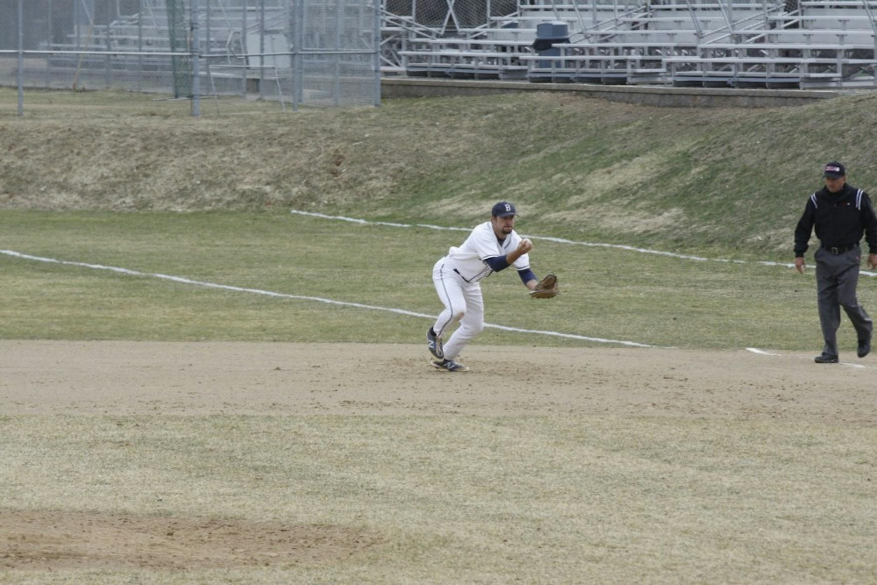 GROUNDBALL: First baseman Kyle Brenner ’15 scoops up the ball against the University of Massachusetts Dartmouth last April.