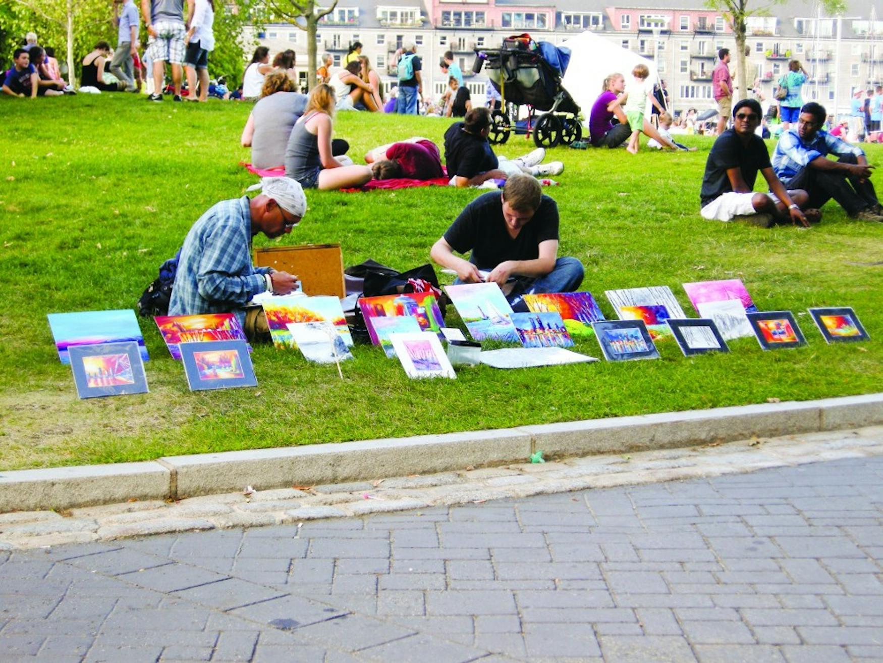 LOCALLY GROWN: Along with the other installations, the festival included many art vendors, including these men selling small hand-painted, colorful artwork.