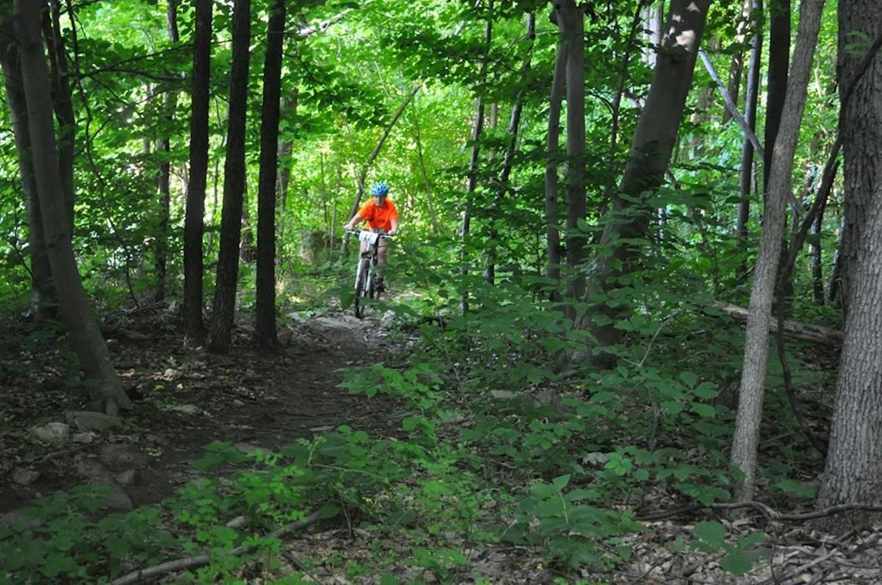 PEDAL TO THE METAL: Hochman bikes through the beginning of the mountain-bike section of the Xterra Dirty Grizzly, winning first in her age group at her first triathlon, near her home in Bear Creek Ski Resort in Macungie, PA.