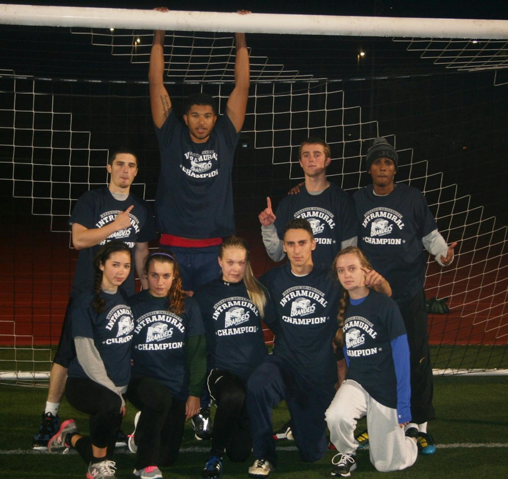 VICTORY FORMATION: Members of Team Colby pose for a photograph after their win in the coed intramural outdoor soocer final.